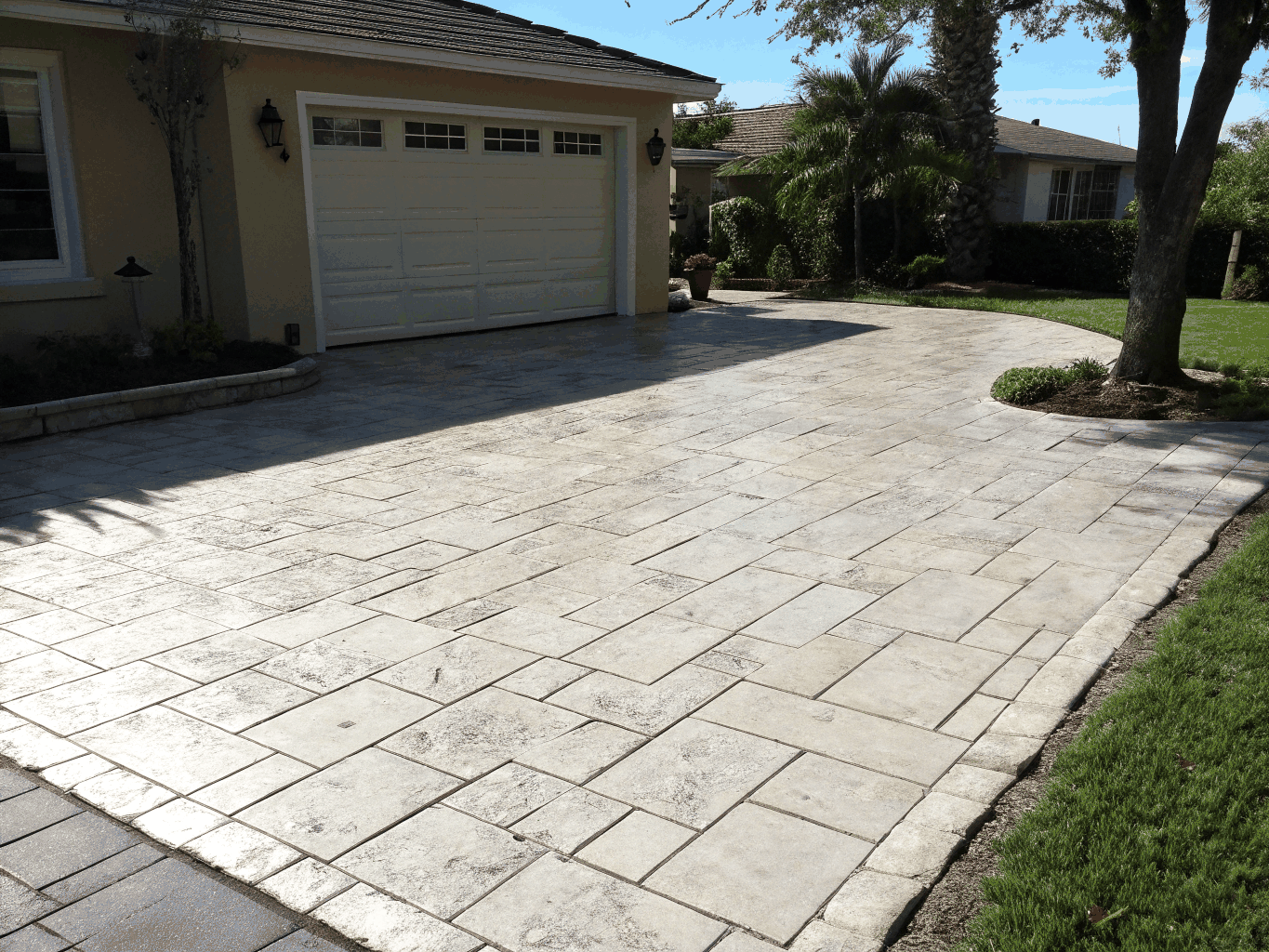 Restored stone block driveway fully cleared of moss and protected with matte stone sealant